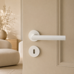 Minimalistische deurklink met ronde greep in wit